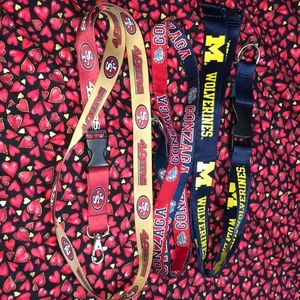 3 lanyards. SF 49ers. Wolverines. Gonzaga